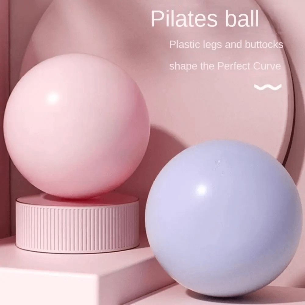 Pastel pink and blue Pilates balls for home gym workouts, emphasizing leg and hip sculpting, flexibility, and balance training.