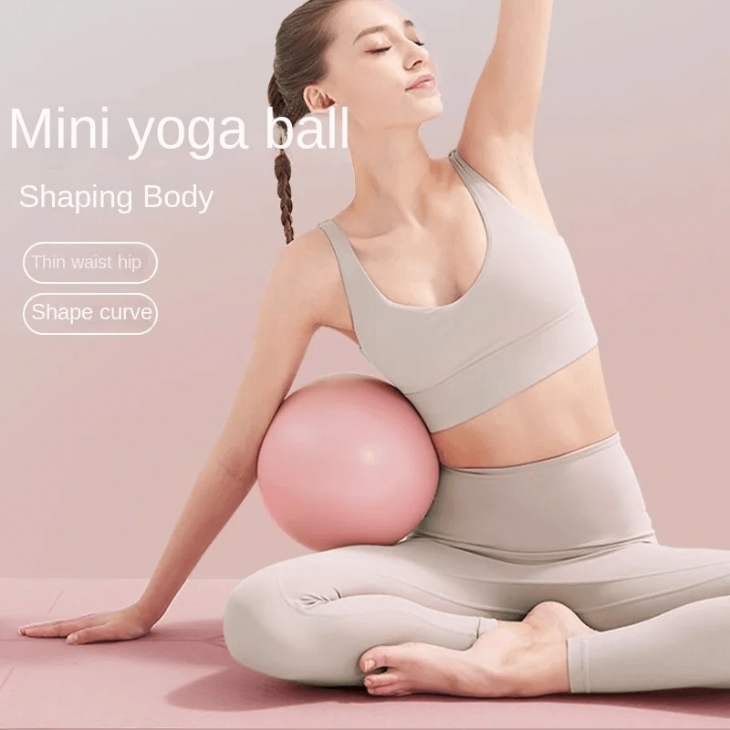 Woman using anti-explosion mini Pilates yoga ball for shaping body, ideal for legs and hips workout. Enhance flexibility and core strength.