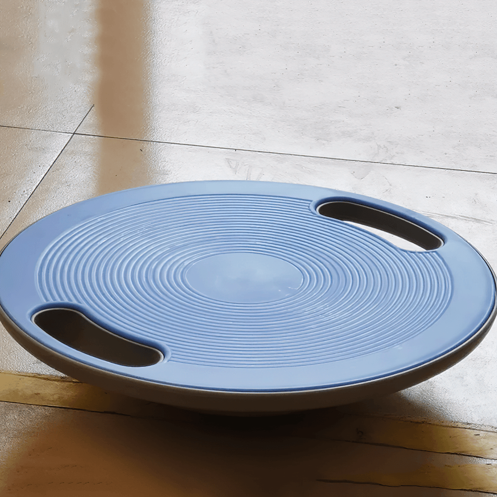Anti-Slip Fitness Balance Board with Handles - SF3501 resting on a wooden floor, showcasing its sturdy design and practical handles.
