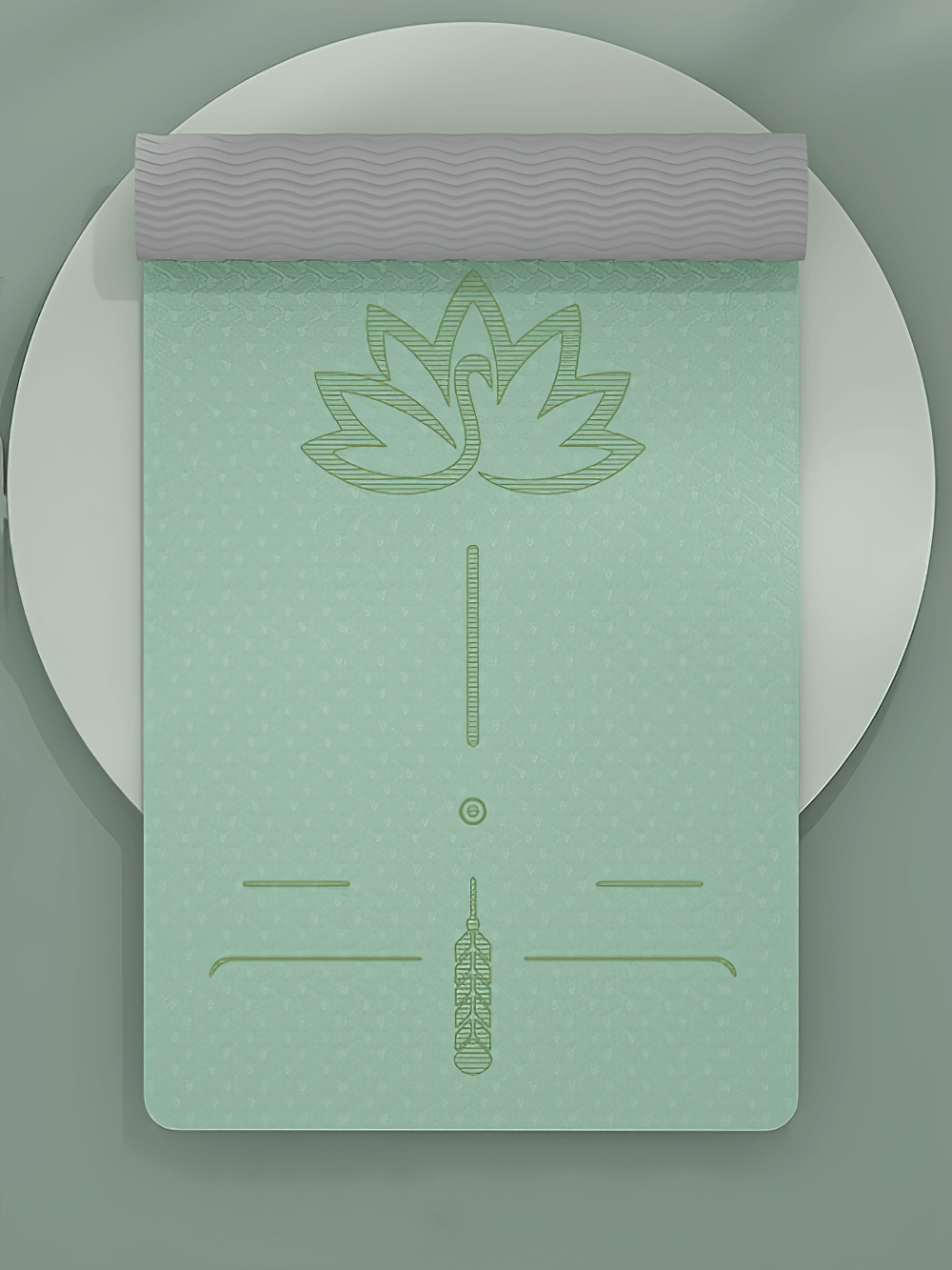 Mint green anti-slip fitness mat with lotus guide lines and textured grip for yoga and pilates on a smooth surface.