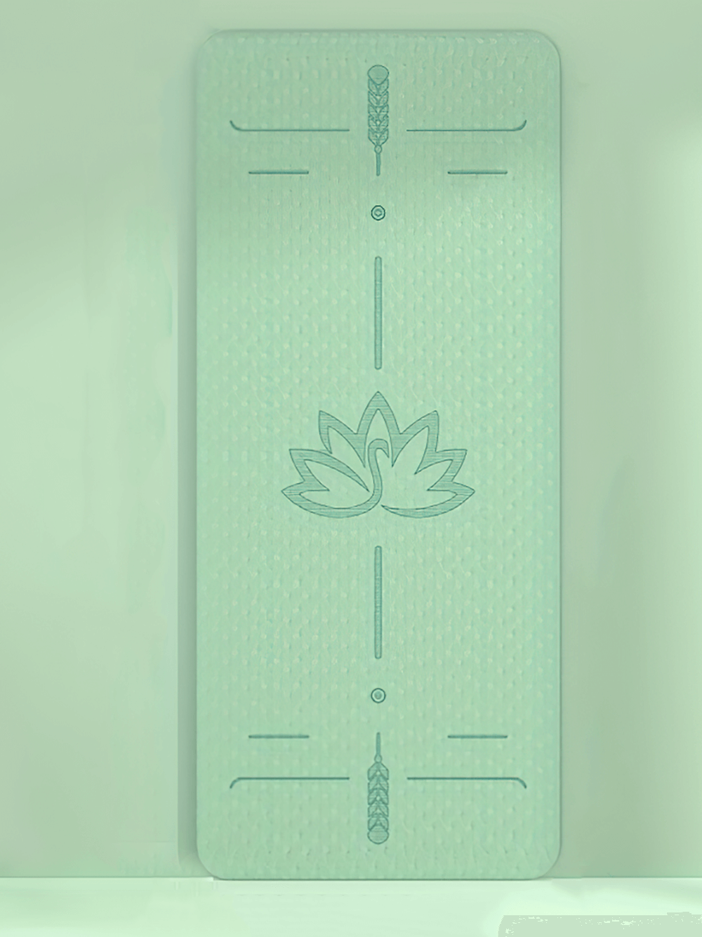 Mint green anti-slip fitness mat with lotus alignment guide, perfect for yoga and pilates, featuring thick, durable double-layer design.