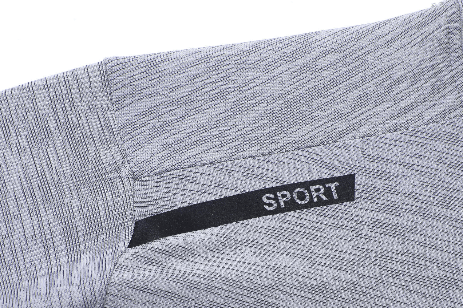 Close-up of gray athletic breathable t-shirt with black 'SPORT' design; features soft, modern fabric perfect for active wear.