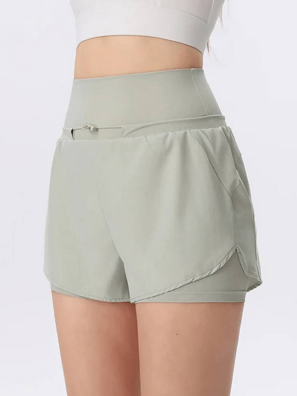 Light green high waist women's gym shorts, breathable and quick-drying, perfect for spring and summer workouts.