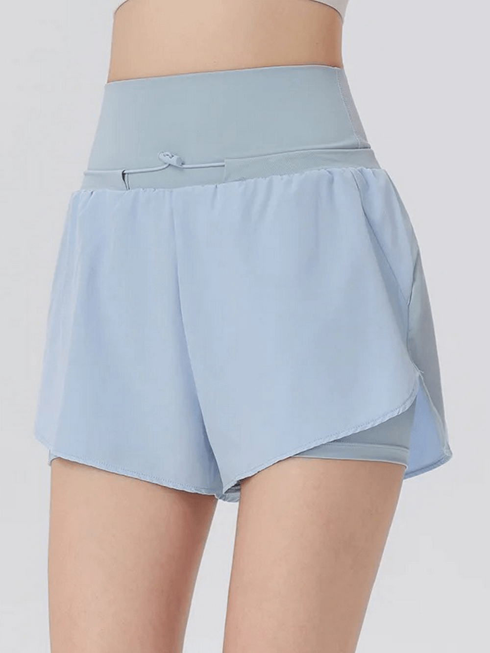 Light blue athletic high waist shorts for women, breathable and quick-drying, perfect for spring and summer workouts.