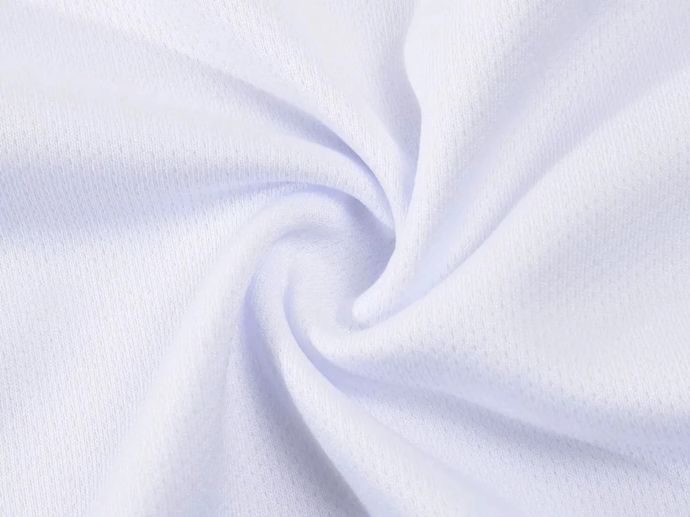 Close-up of breathable white polyester fabric in athletic sportswear, highlighting texture and resilience for outdoor activities.