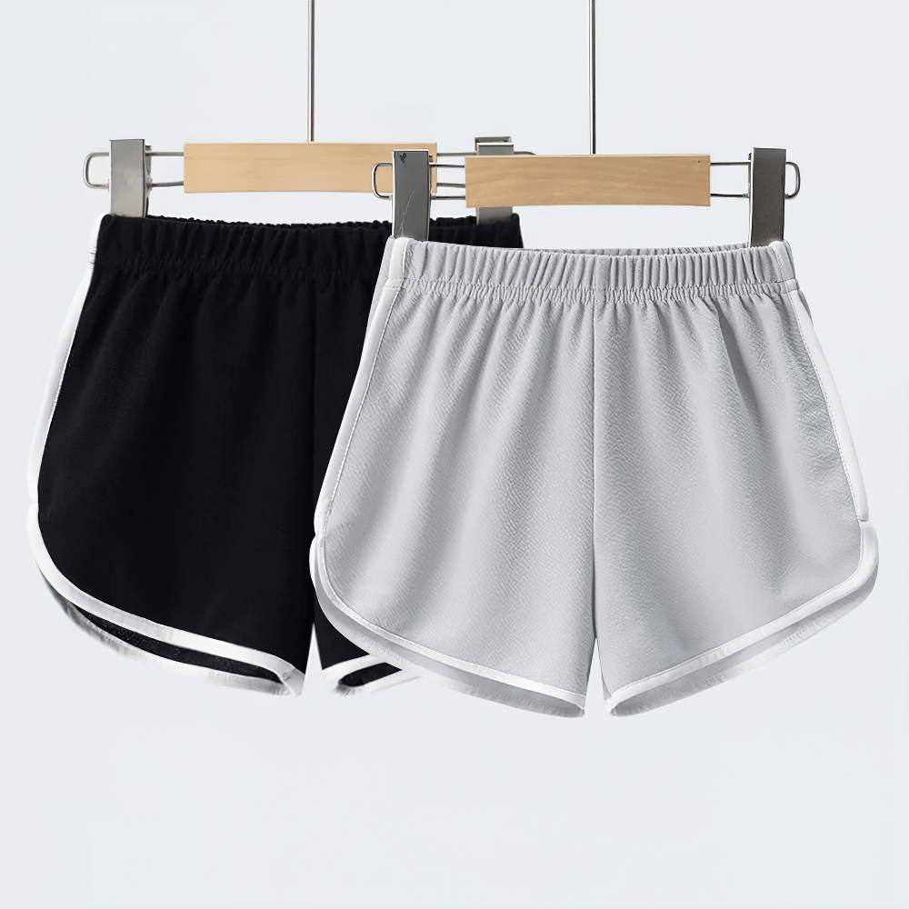 Athletic Shorts With Elastic Waist and Side Trim - SF3732 in black and white hanging on hangers.