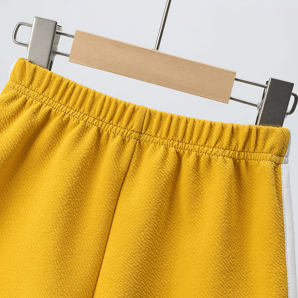 Athletic Shorts With Elastic Waist and Side Trim - SF3732 on hanger, featuring close-up of elastic waist and side detail in vibrant yellow.