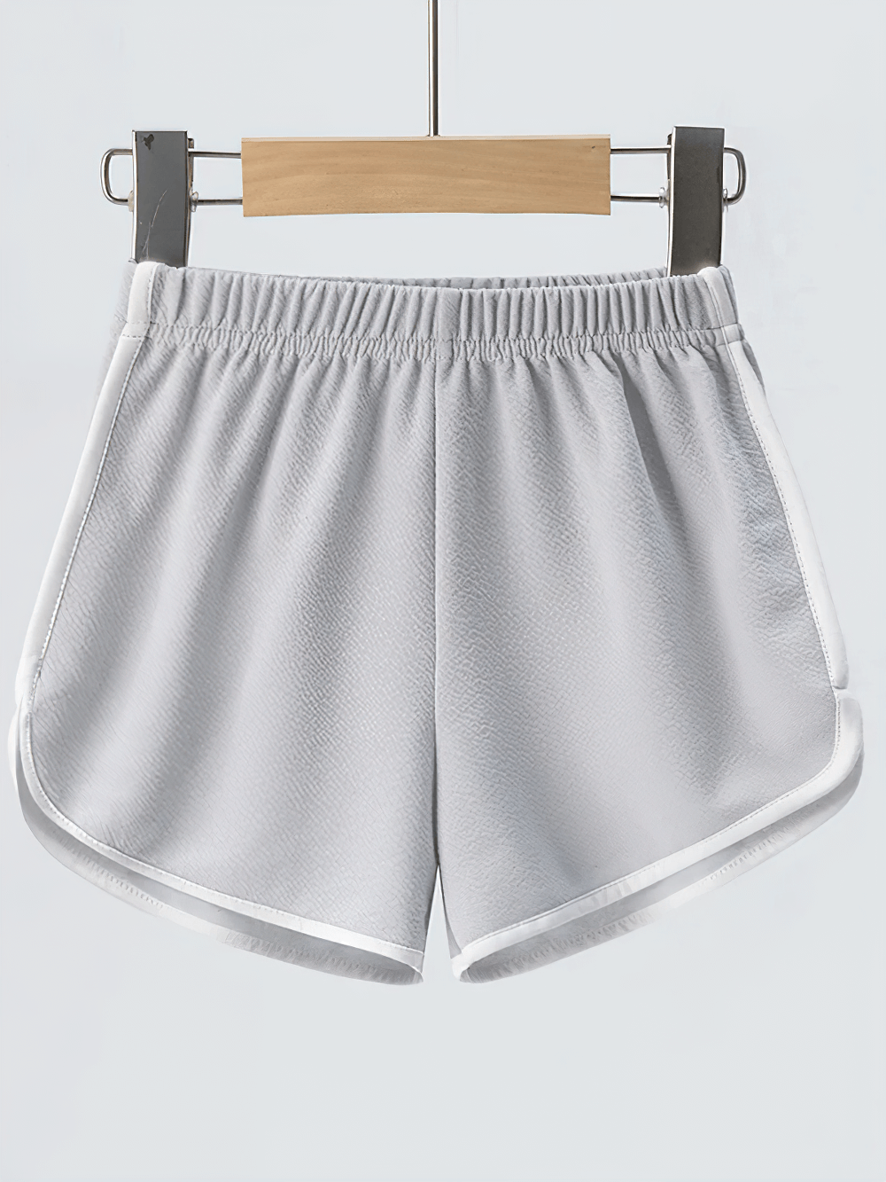 Athletic Shorts With Elastic Waist and Side Trim - SF3732 hanging on a rack, showcasing sporty style and comfort.