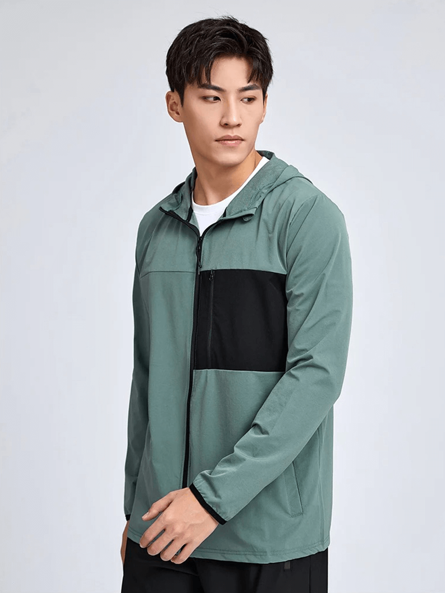 Man wearing athletic windbreaker with zip and hood, SF2010, sporty design, ideal for outdoor activities and casual outings.