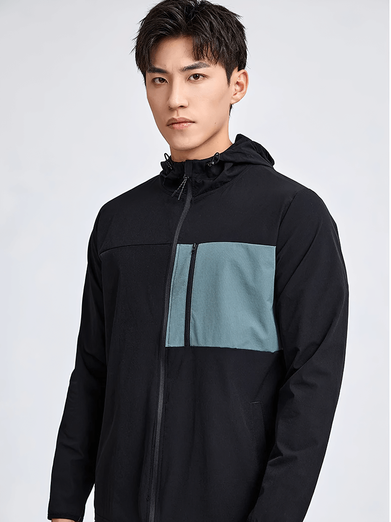 Men's black and teal athletic zip-up windbreaker with hood, ideal for outdoor activities and style. Model wearing SF2010 jacket.