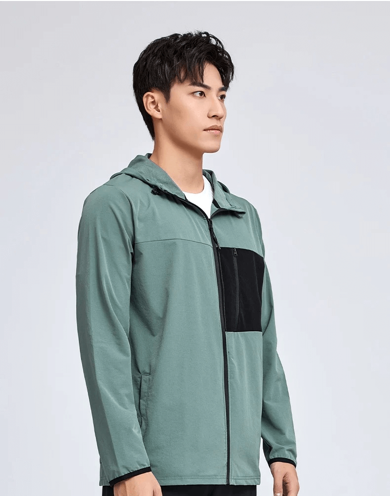 Athletic zip-up windbreaker for men in green with black accents, ideal for outdoor activities and casual wear, featuring a hood and pockets.