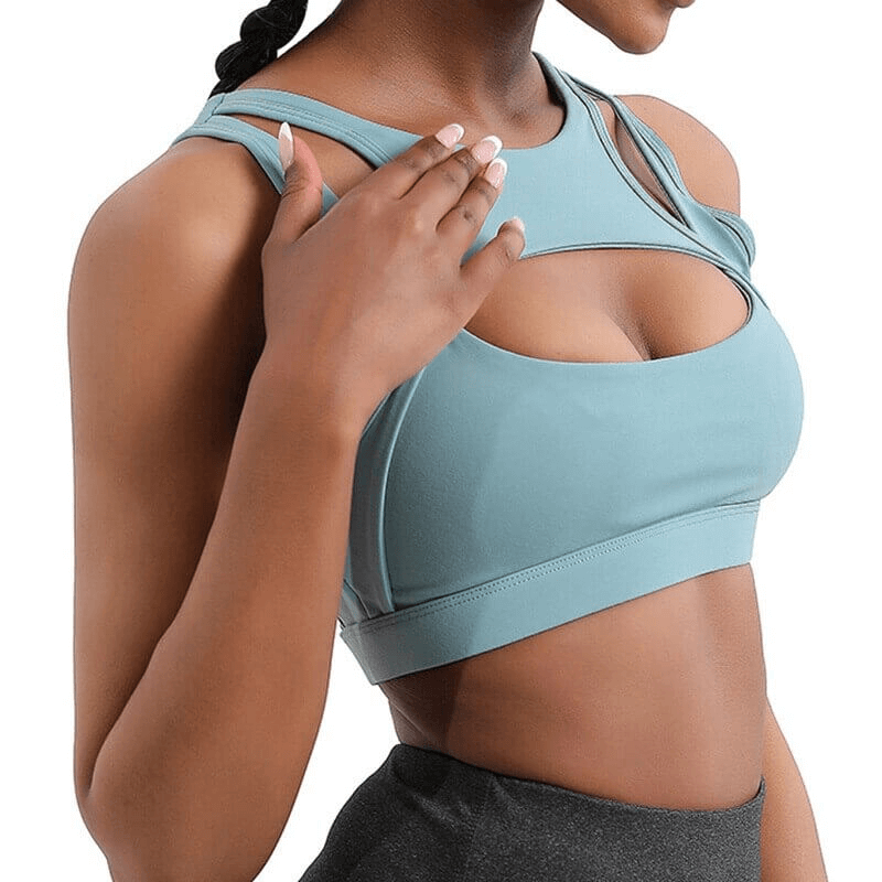 Stylish athletic women's sports bra in blue, perfect for yoga and running, featuring breathable quick-dry fabric and supportive design.