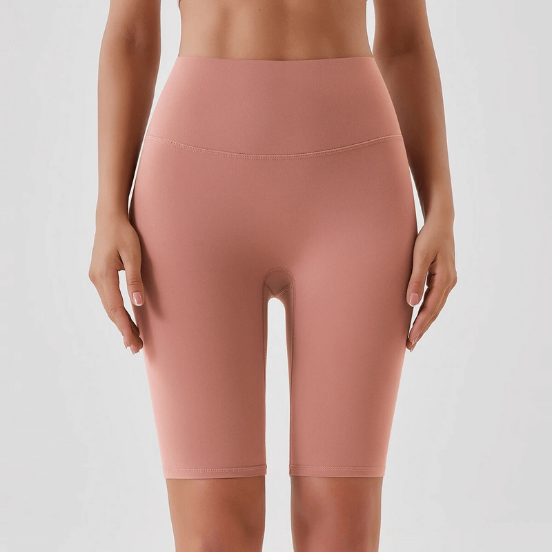 Athletic women's high-waist tight shorts in rose, perfect for yoga and running, offering comfort and support.