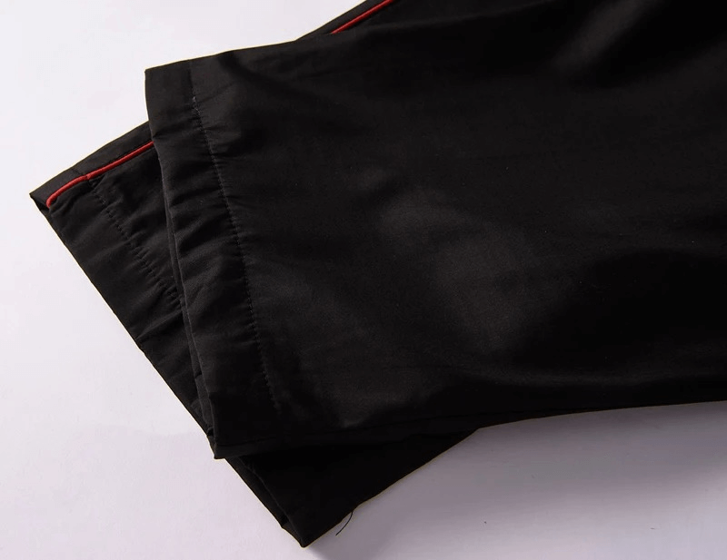Close-up of black elastic waist pants with red accents, part of the SF2037 men's stylish athletic zip jacket and tracksuit set.