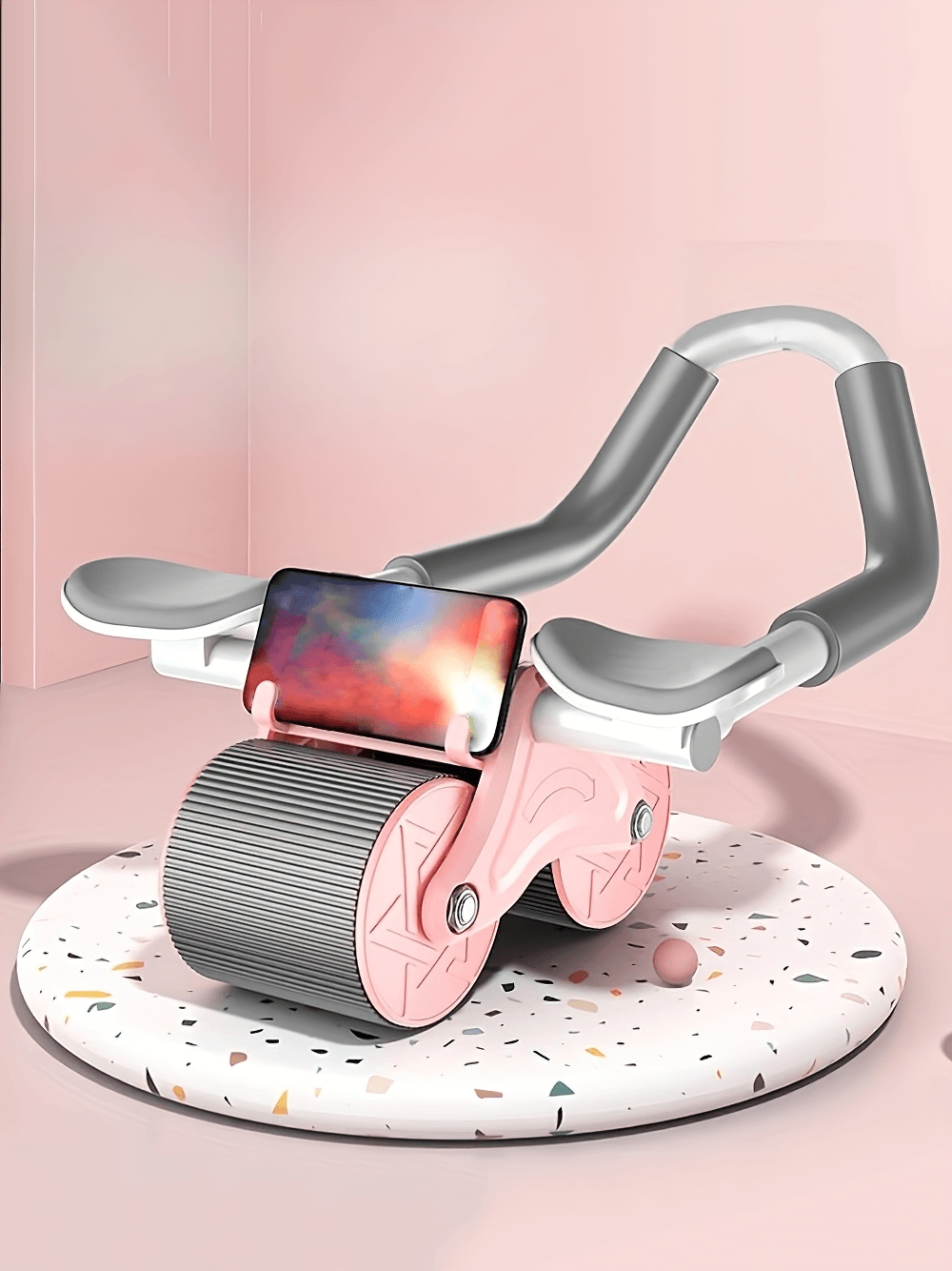 Pink automatic rebound ab roller with elbow support and phone holder on display, ideal for core strength and stability workouts.