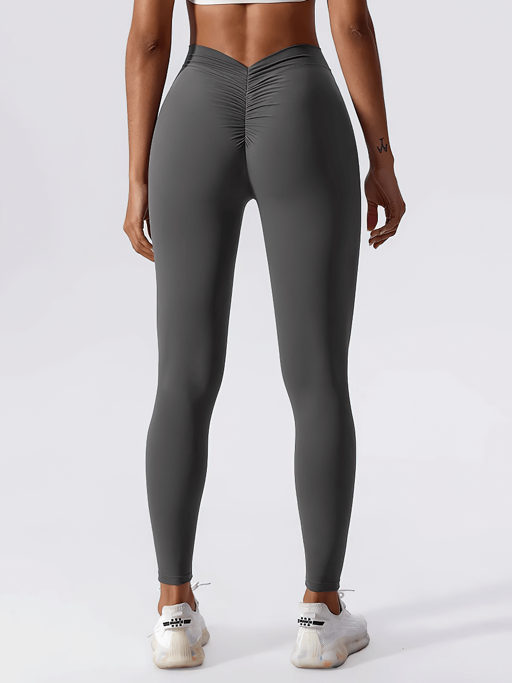 Back view of Back V-Waist Hip Lift Yoga Leggings for Women - SF4006, highlighting the ruched seam and high-rise fit in gray.