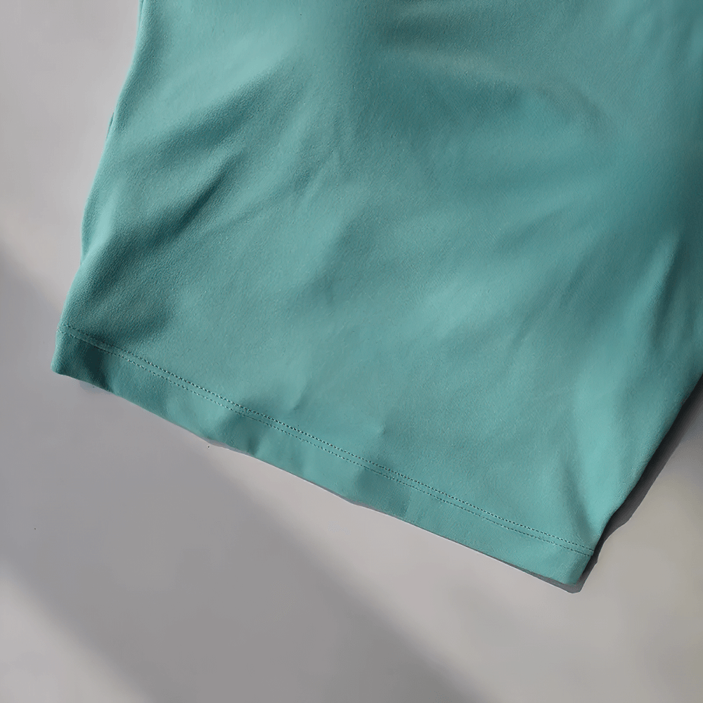 Close-up of turquoise fabric on the Backless Hollow Long Sleeve Yoga Top with Pads - SF4134