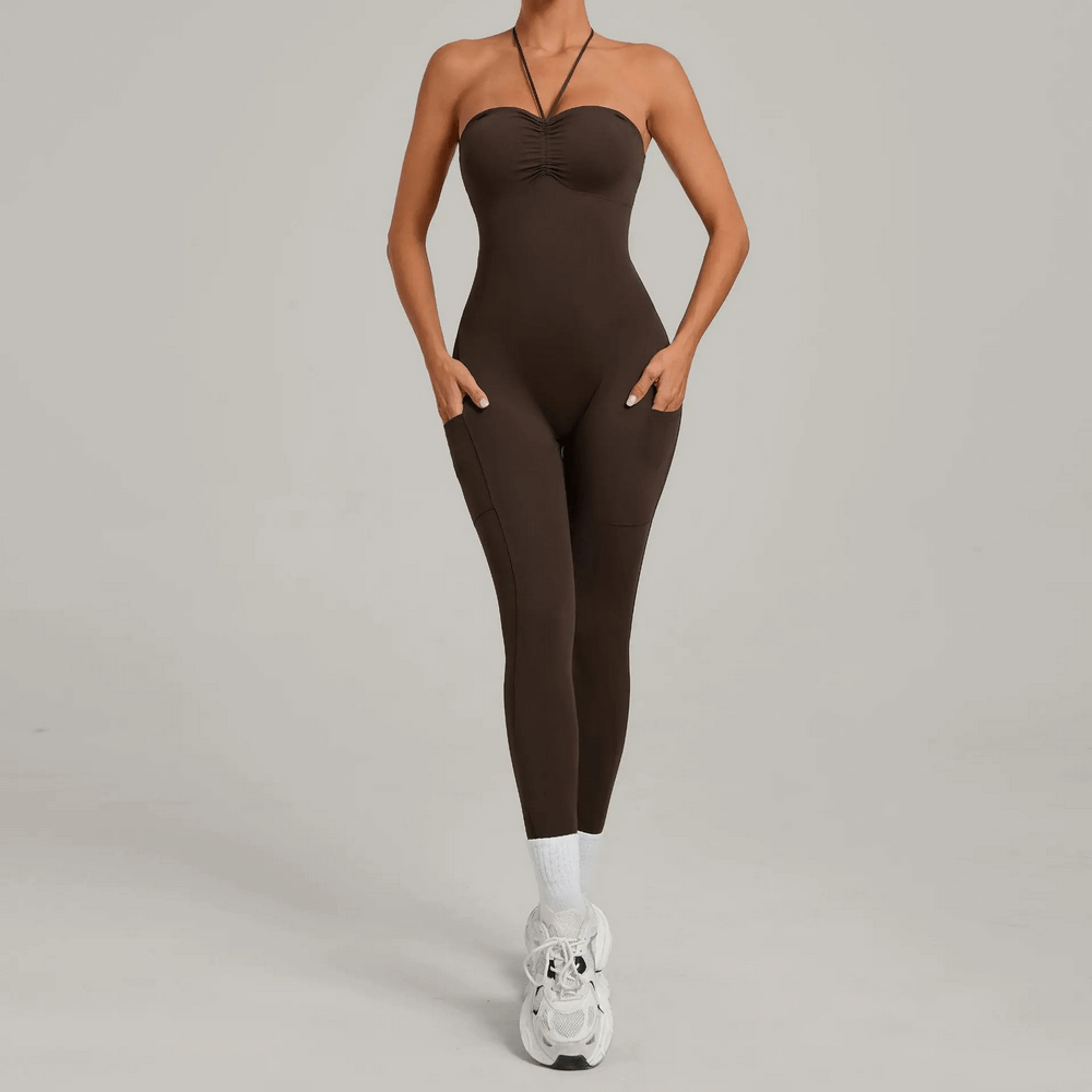 Woman wearing Backless Yoga Jumpsuit with Pockets and Halter - SF4261, showcasing seamless design and side pockets.