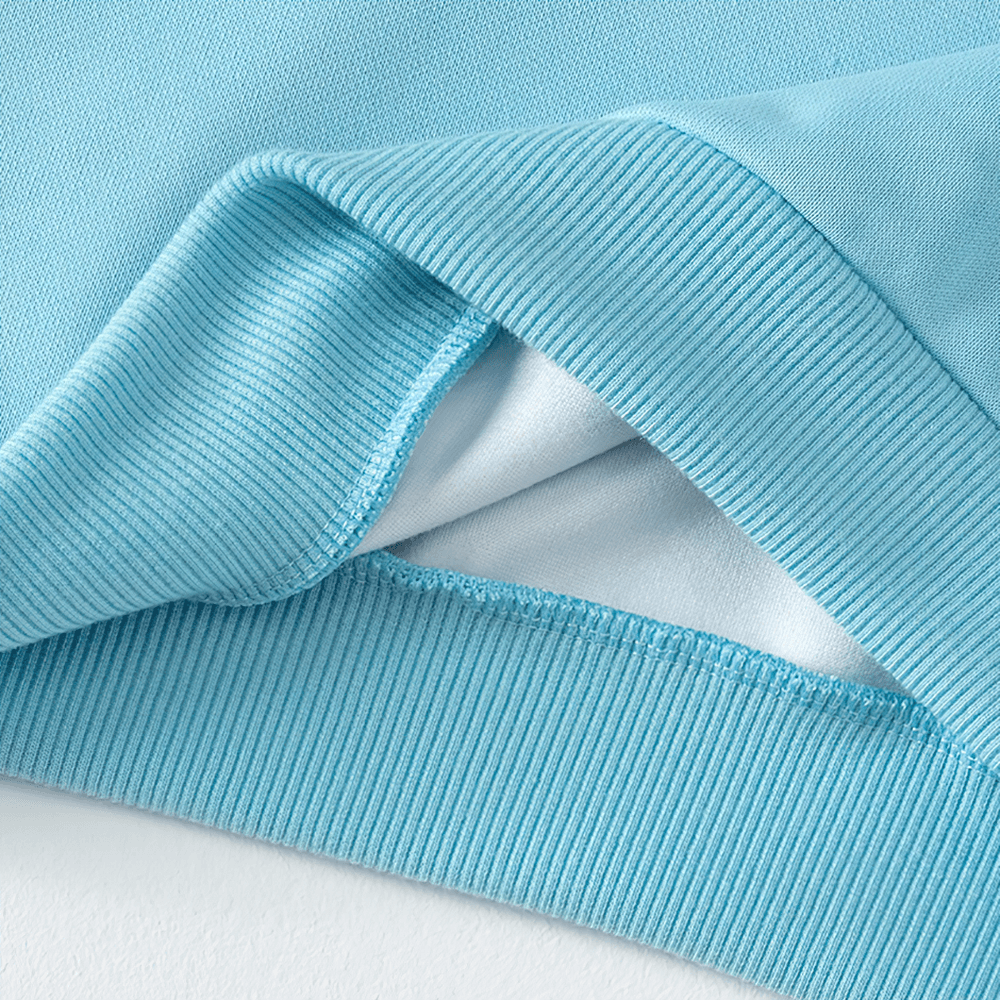 Close-up of blue Basic Crew Neck Solid Color Sweatshirt - SF3539, showcasing soft fleece fabric and ribbed details. Perfect for kids' casual wear.