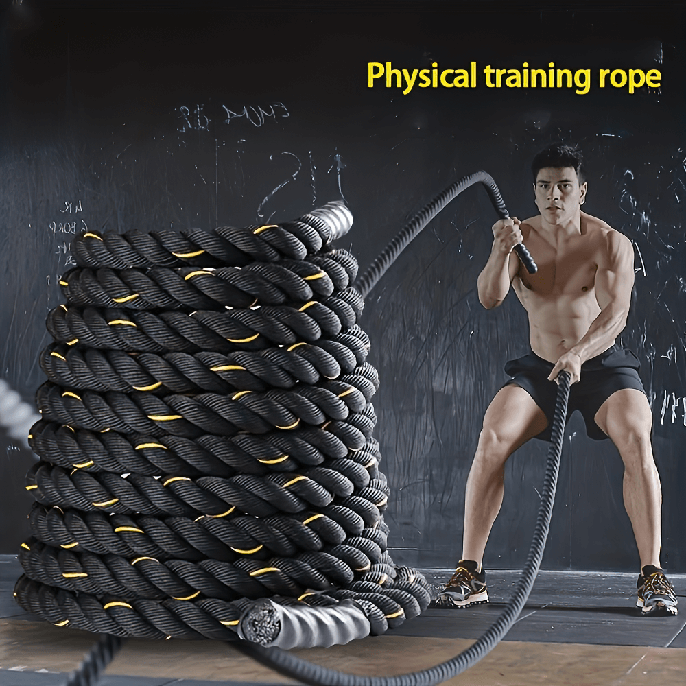 Man using heavy-duty battle rope for strength training in gym, intense workout with thick fitness rope for core conditioning. SF2884