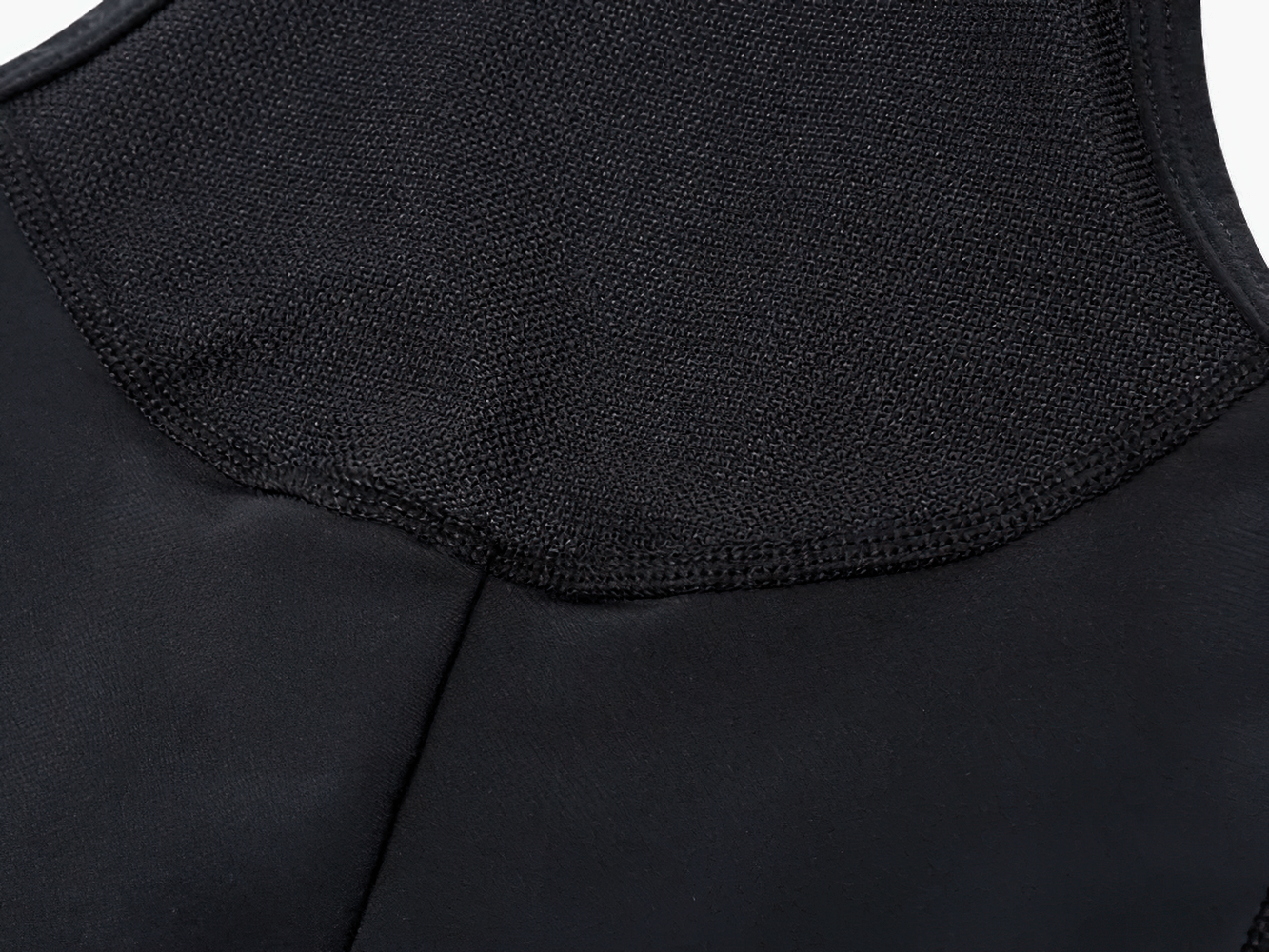 Close-up of breathable and comfortable fabric on men's cycling bib shorts, featuring quick-dry technology for optimal summer performance.