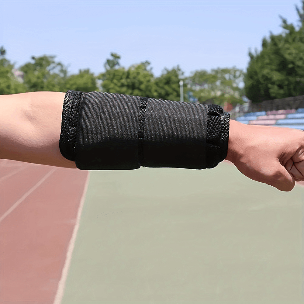 Black adjustable weighted armband on arm, perfect for fitness training and running.