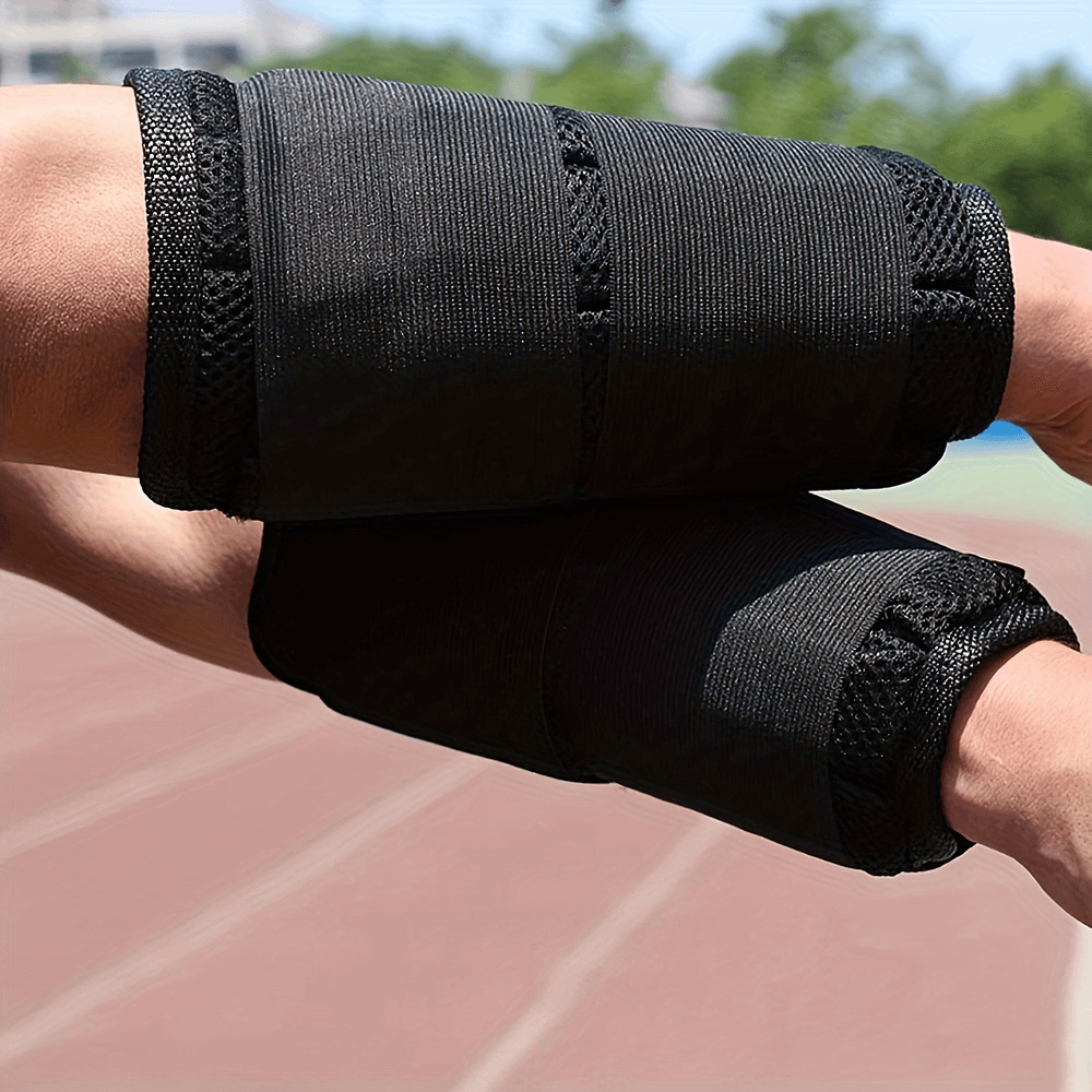 Black adjustable weighted nylon armbands, perfect for fitness training and enhancing workout intensity, shown in use outdoors.