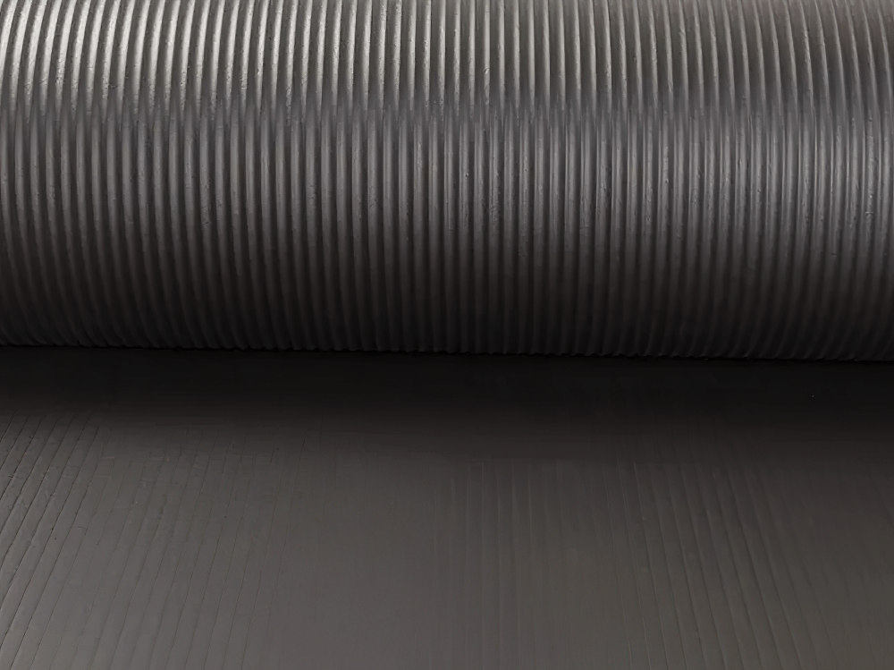 Close-up of black and red non-slip yoga mat, durable eco-friendly design for fitness, pilates, stretching, floor workouts.