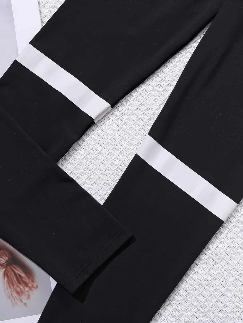 Close-up of Black and White Contrast Waistband Sports Leggings - SF3675 showcasing bold stripes and high-elastic fabric.