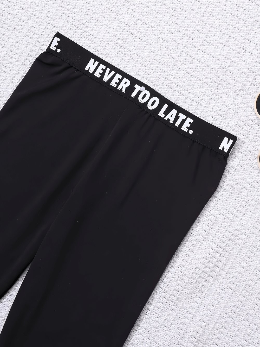 Black and White Contrast Waistband Sports Leggings - SF3675, featuring 'Never Too Late' motivational message for fitness and style.