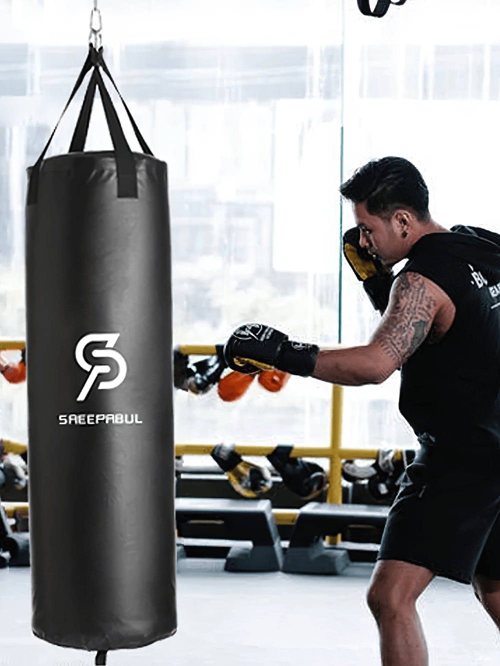 Boxer training with a black hanging punching bag, model SF2721, unfilled synthetic leather sandbag designed for intense workouts.