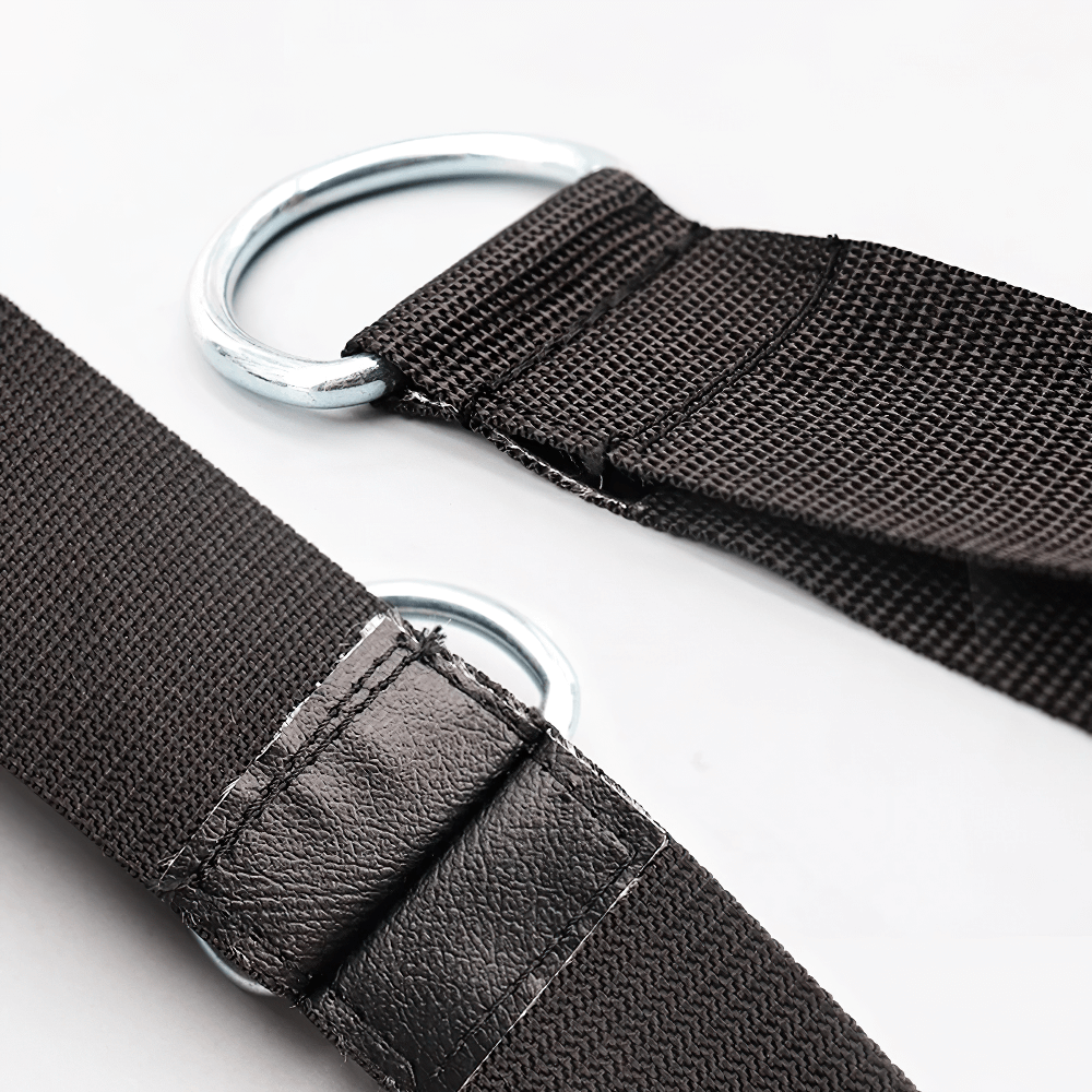 Close-up of secure hanging straps with metal rings for black punching bag SF2721, showing reinforced stitching and durable materials.