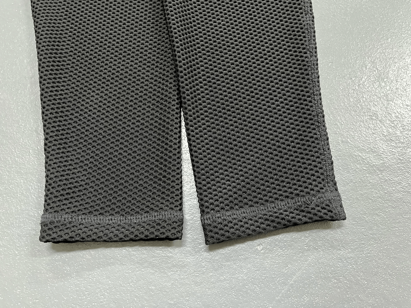 Close-up of Black High Waist Mesh Yoga Leggings for Women - SF3999 showcasing ultra-thin mesh texture and detailed craftsmanship.