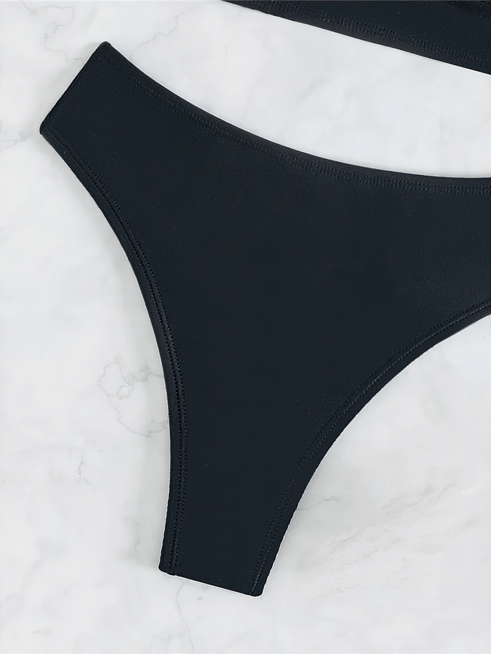 Black Plunge Bikini Set with Mid Waist Bottoms - SF4757 mid-waist bottoms on a marble surface.