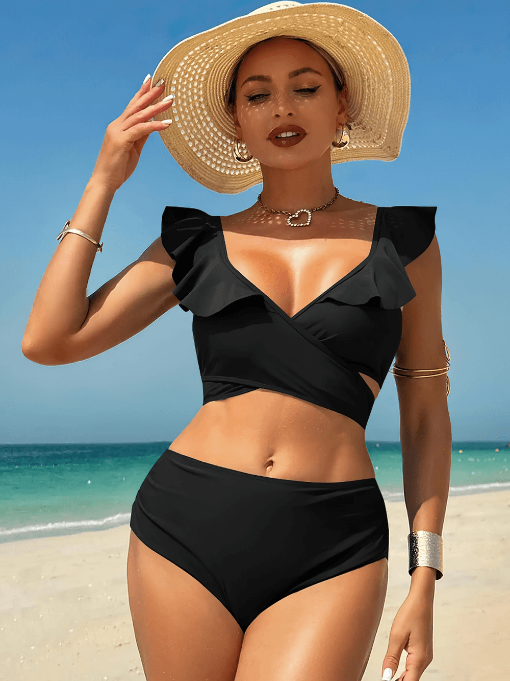 Black Ruffle Wrap High Waist Two Piece Swimsuit - SF4681 on a model at the beach wearing a stylish wide-brimmed hat.