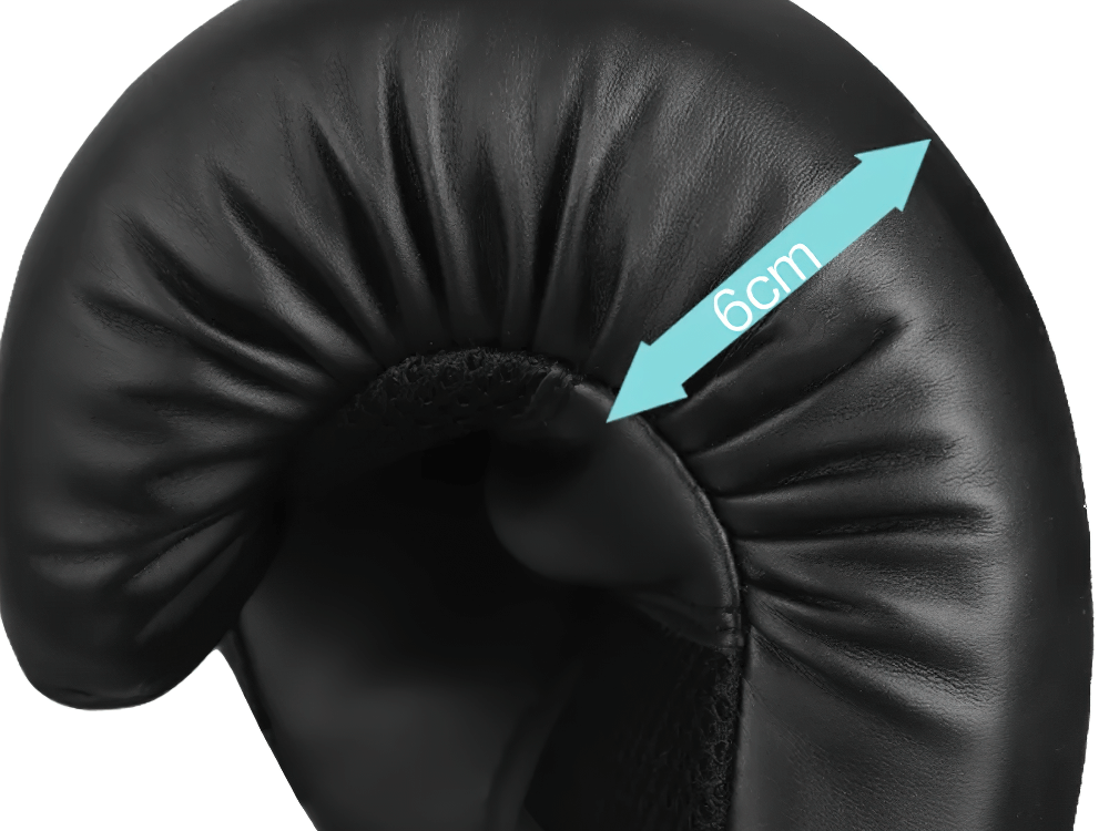 Close-up of black boxing glove featuring 6cm padding, ideal for sparring and heavy bag training.