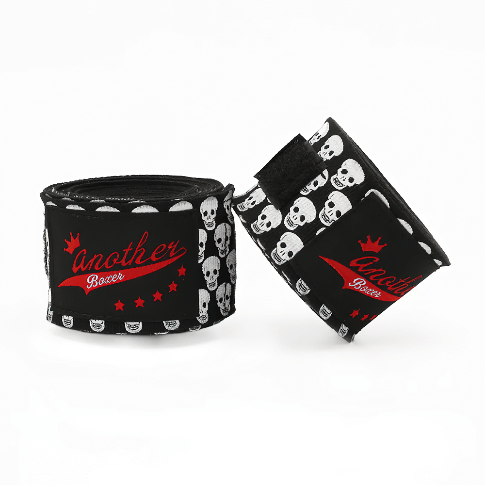 Black boxing hand wraps with skull print and red accents for wrist support and training.