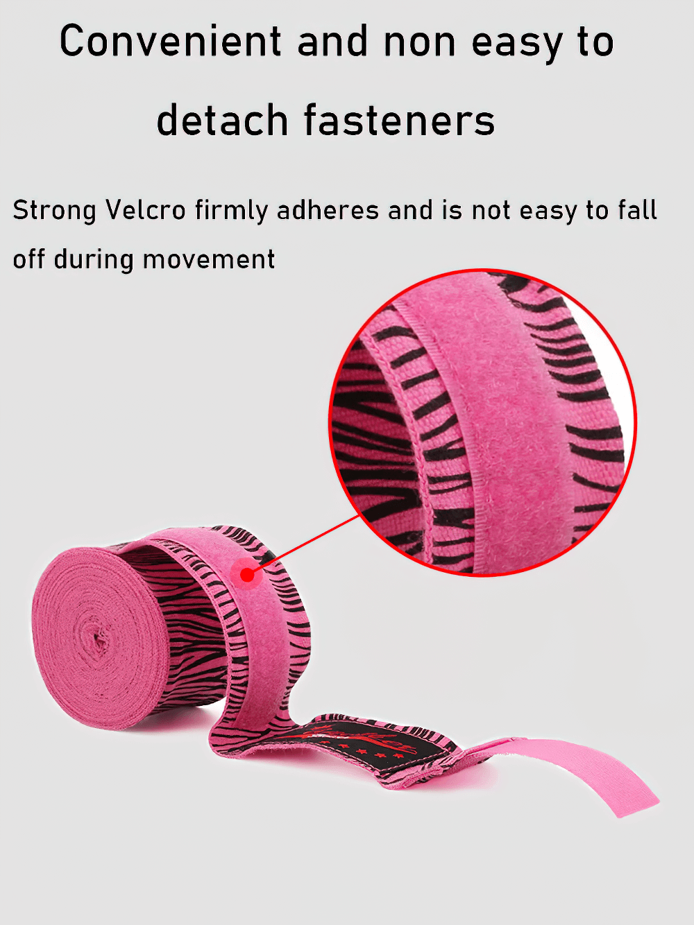 Pink printed boxing hand wraps with Velcro fastener, featuring zebra stripes pattern, provide wrist support and strong adhesion for training.