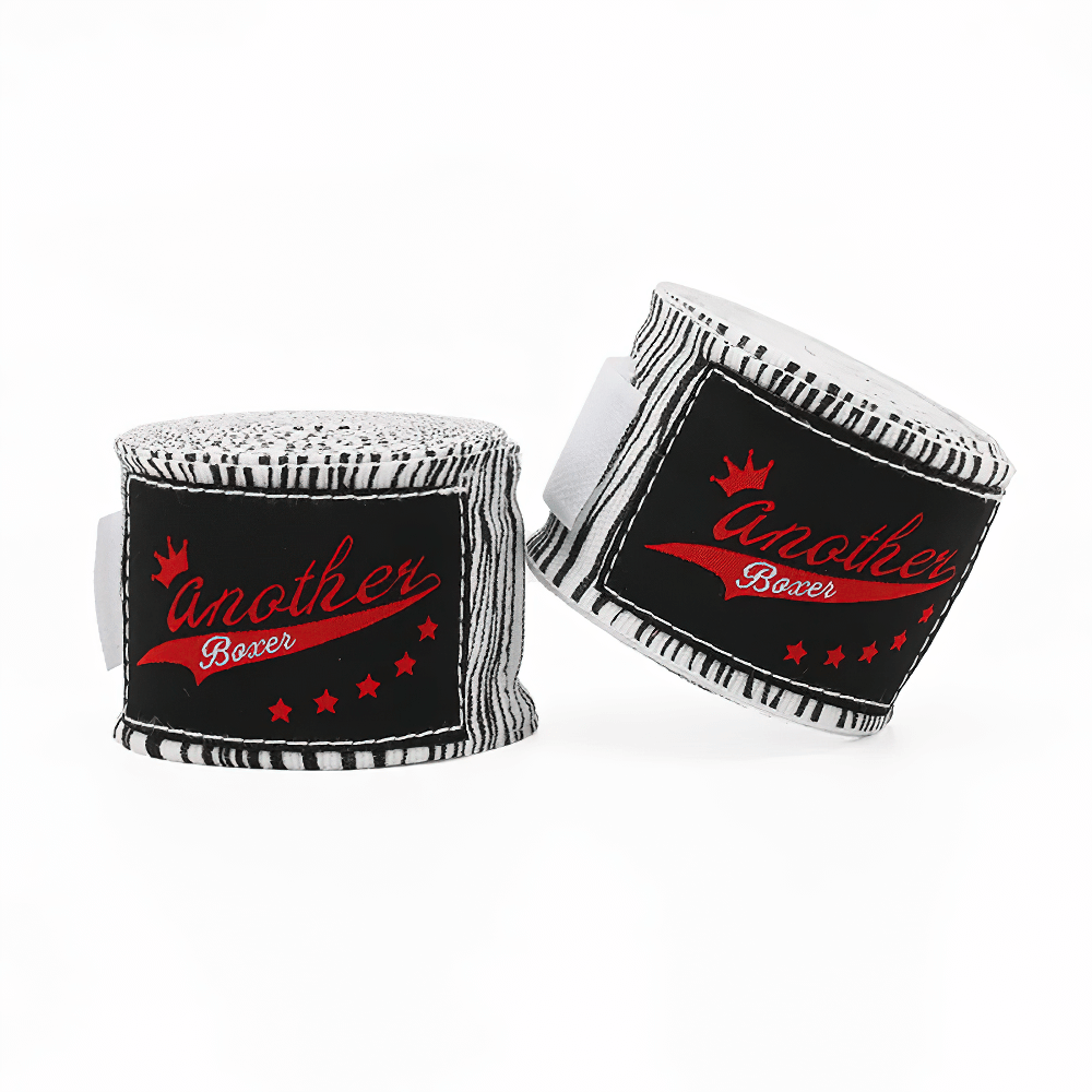 Printed boxing hand wraps with wrist support featuring bold black and white patterns, ideal for training and sparring.
