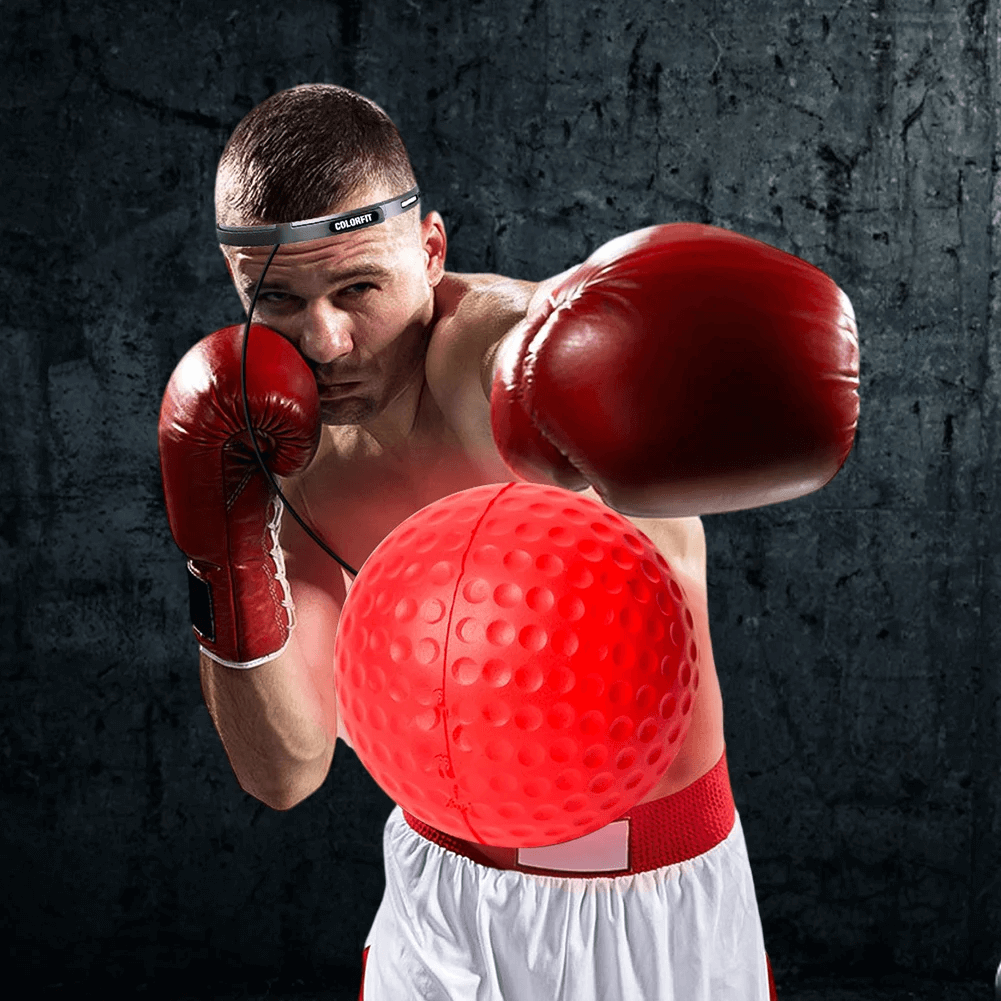Boxer training with reflex ball and headband, improving speed and coordination for boxing and MMA drills.