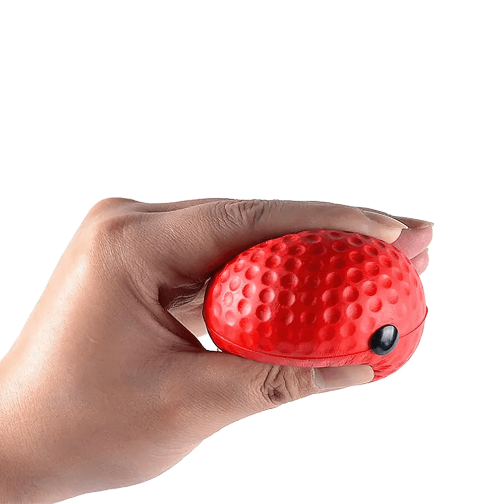 Hand holding a red boxing reflex ball with dimpled texture for agility training and reaction practice