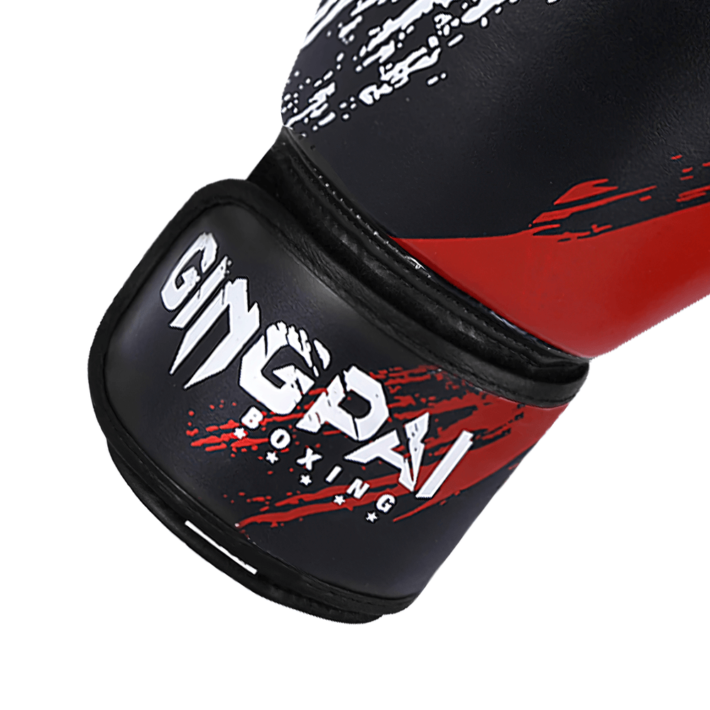 Red and black boxing training gloves with splash paint design, featuring hook-and-loop strap for secure fit. Ideal for sparring and fitness.