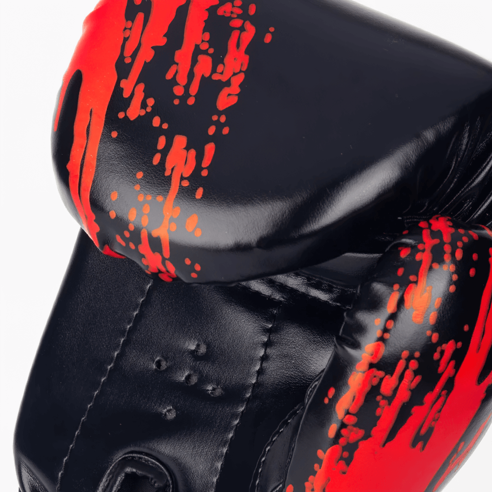 SF3138 Boxing Gloves with red paint splash design, PU leather, multi-layered padding, and wide wrist strap for sparring and fitness.
