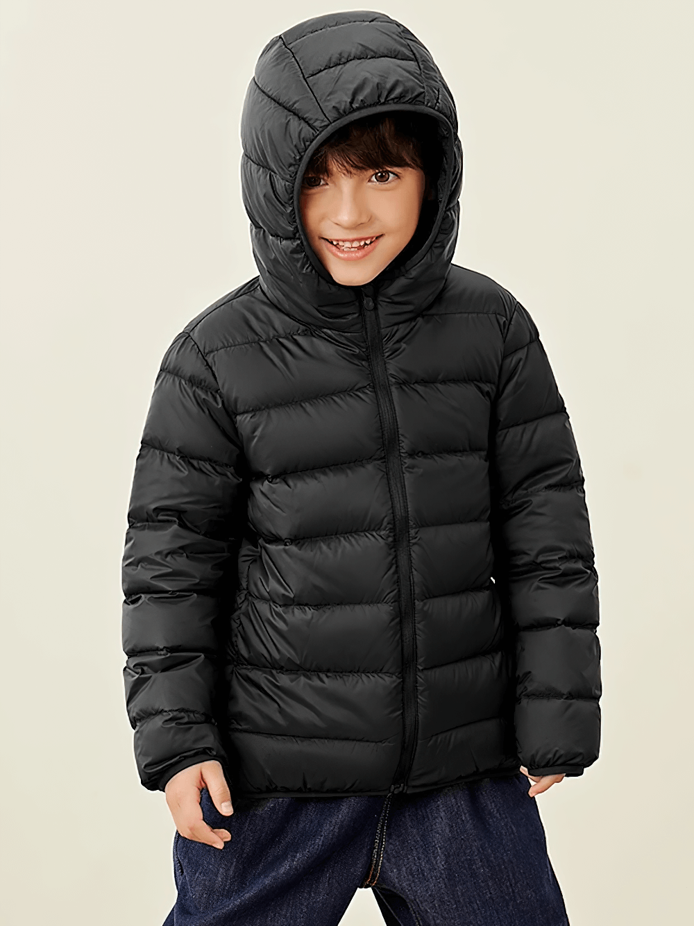 Boy wearing Boys and Girls Puffer Down Jacket for Cold Weather - SF3691, standing and smiling in a cozy, black eco-friendly design.