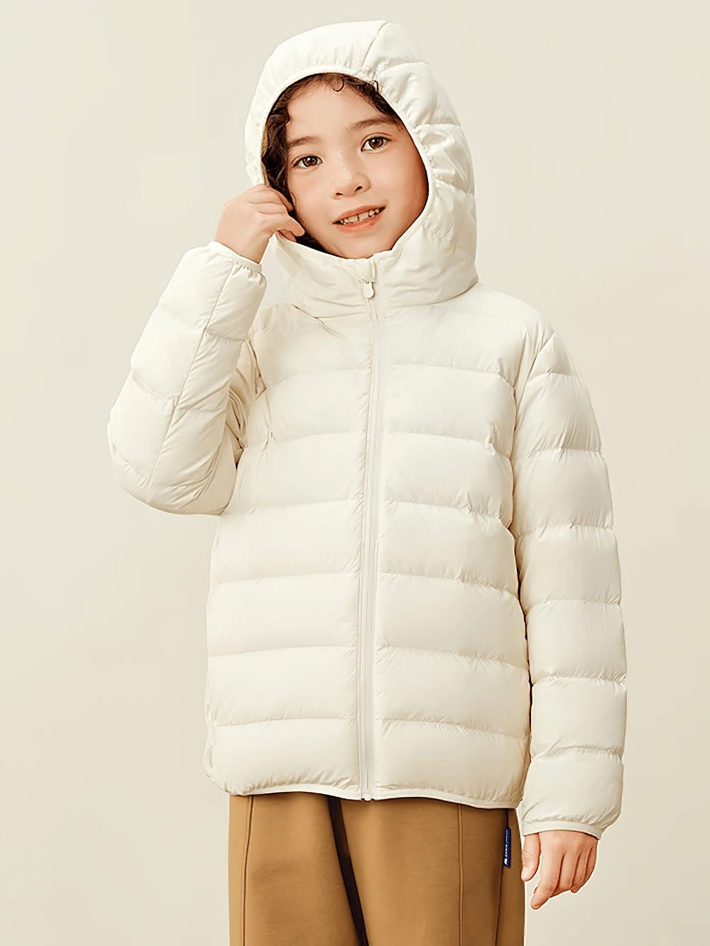 Child wearing Boys and Girls Puffer Down Jacket for Cold Weather - SF3691 in white, smiling and standing indoors.
