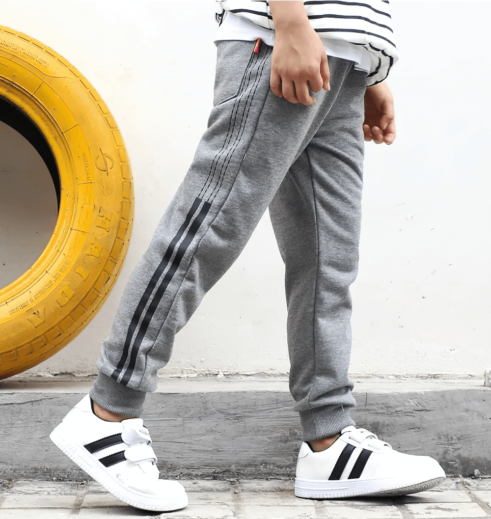 Boy wearing Boys Athletic Jogger Sweatpants with Pockets - SF3611, featuring elastic waistband and pocket design, ideal for active movement.