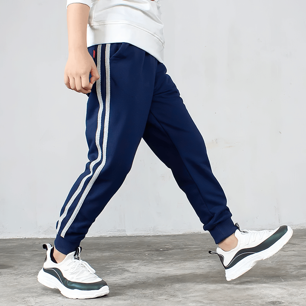 Boy wearing navy Boys Athletic Jogger Sweatpants with Pockets - SF3611, showing side and back pockets, elastic waistband, and sporty style.