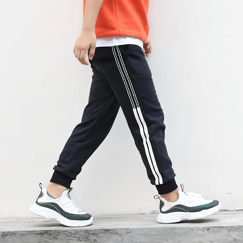 Boy wearing Boys Athletic Jogger Sweatpants with Pockets - SF3611, featuring cotton comfort and pocket style