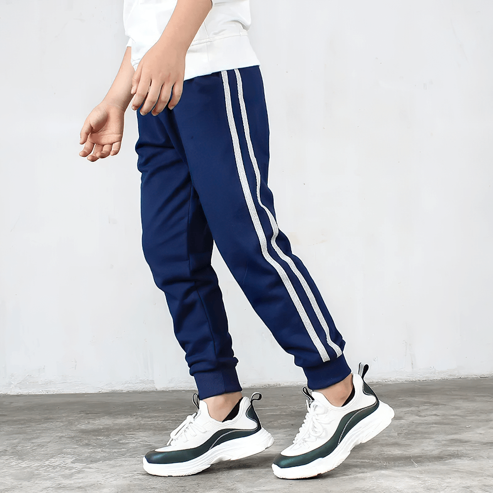 Boy wearing Boys Athletic Jogger Sweatpants with Pockets - SF3611, navy blue with side stripes, perfect for active movement and style.