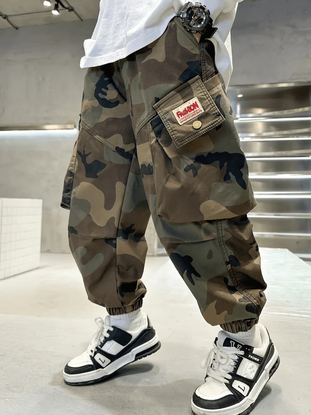 Stylish boys camouflage jogger pants with elastic waist - SF3871, featuring pockets and ruched details against a street-style backdrop.
